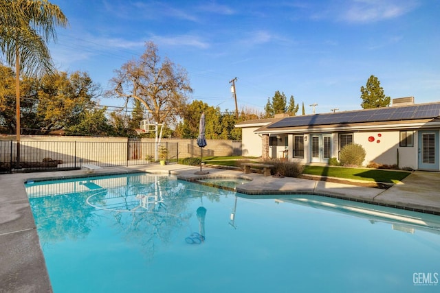 view of pool with an in ground hot tub, fence, and a fenced in pool