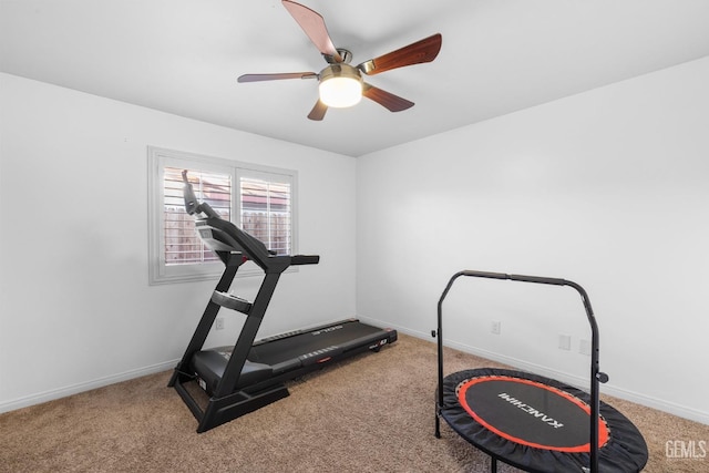 workout room featuring carpet floors, a ceiling fan, and baseboards