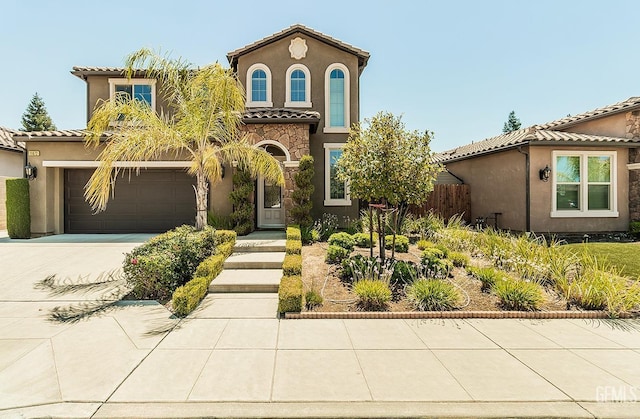 mediterranean / spanish-style home featuring a garage