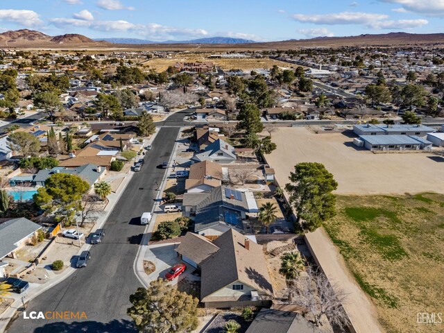 birds eye view of property featuring a mountain view