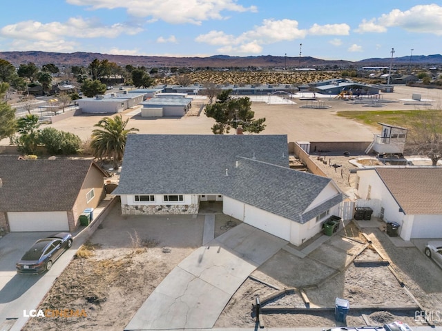 drone / aerial view featuring a mountain view