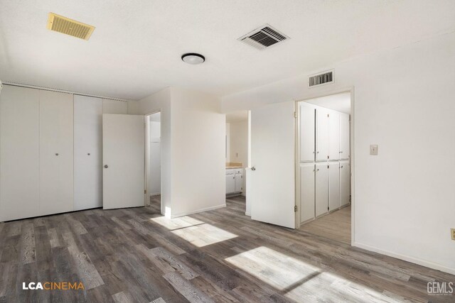 spare room featuring hardwood / wood-style floors