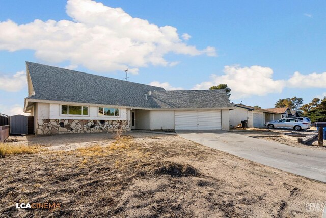 ranch-style home featuring a garage