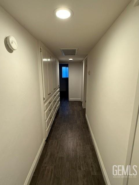 7009 Quailwood Dr, Bakersfield, CA 93309 - hallway featuring dark wood-style flooring and baseboards