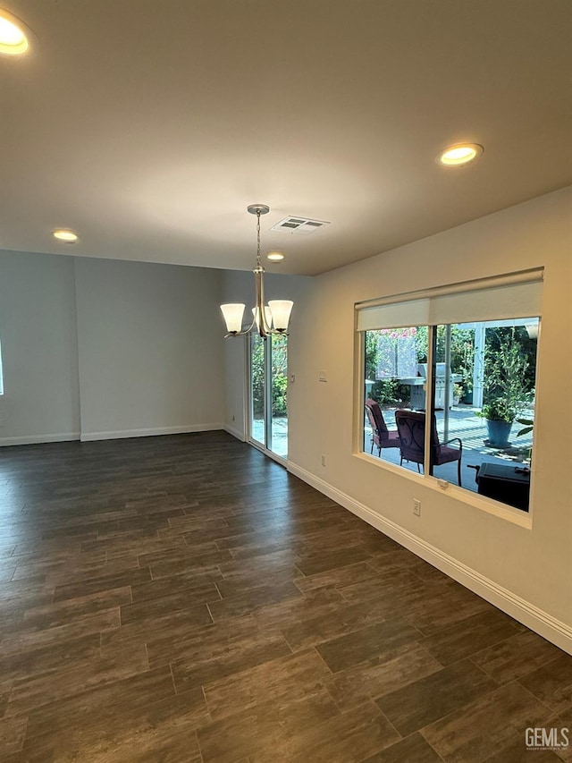 7009 Quailwood Dr, Bakersfield, CA 93309 - unfurnished room featuring a chandelier, recessed lighting, and dark wood finished floors
