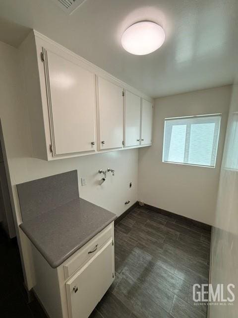 7009 Quailwood Dr, Bakersfield, CA 93309 - laundry area featuring washer hookup, cabinet space, and hookup for an electric dryer