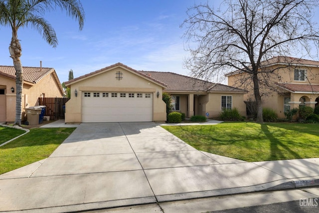 view of front of property with a garage, a front yard, fence, and stucco siding