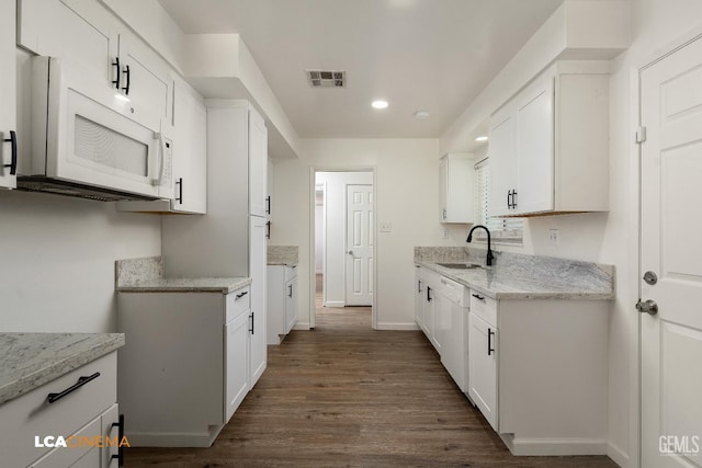 2109 Custer Ave, Bakersfield, CA 93304 - kitchen featuring white appliances, a sink, dark wood-style flooring, light stone counters, and recessed lighting