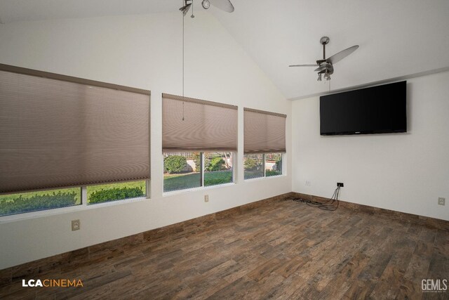 unfurnished living room with dark hardwood / wood-style flooring, high vaulted ceiling, and ceiling fan