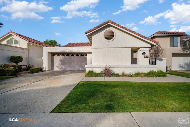 mediterranean / spanish house featuring a garage and a front lawn