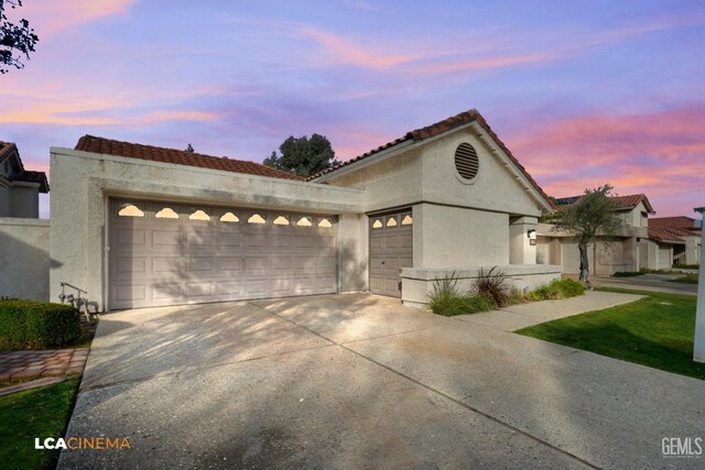 mediterranean / spanish-style house featuring a garage