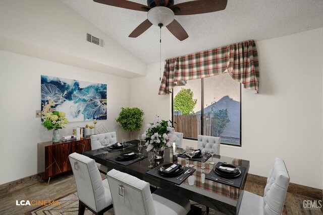 dining space featuring lofted ceiling, ceiling fan, light hardwood / wood-style flooring, and a textured ceiling