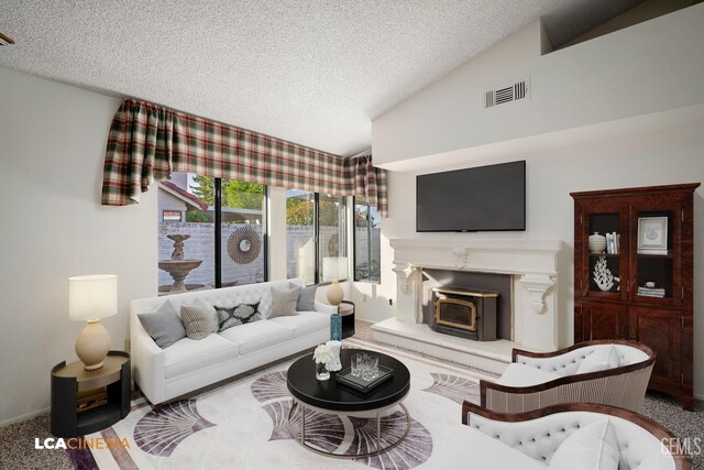 living room featuring vaulted ceiling, a textured ceiling, and carpet