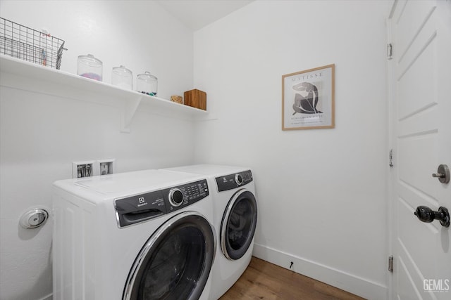 9642 Silver Falls Ln, Shafter, CA 93263 - washroom with washing machine and clothes dryer, wood finished floors, and baseboards
