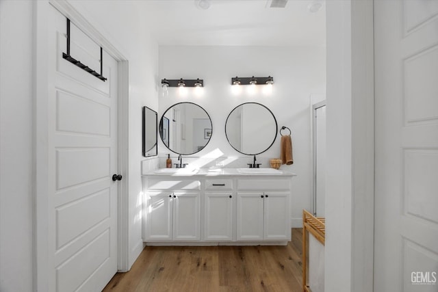 9642 Silver Falls Ln, Shafter, CA 93263 - full bathroom featuring wood finished floors and double vanity