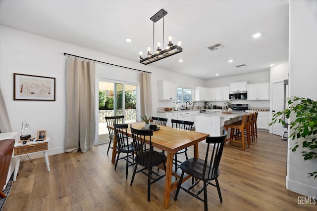 9642 Silver Falls Ln, Shafter, CA 93263 - dining room featuring light wood finished floors, baseboards, and recessed lighting