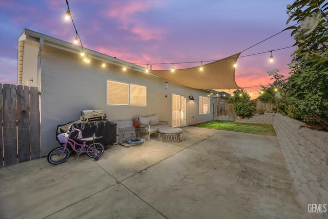 9642 Silver Falls Ln, Shafter, CA 93263 - back of property at dusk featuring a patio area and stucco siding