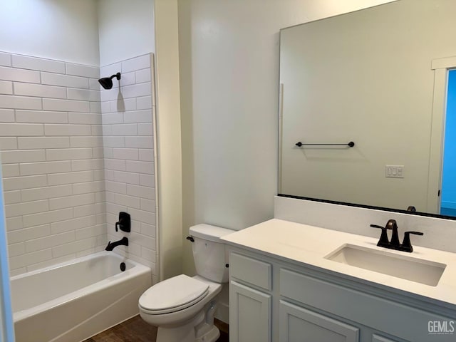 bathroom featuring shower / bathtub combination, toilet, and vanity