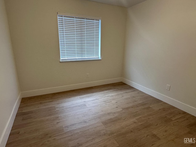 320 10th St, Mc Farland, CA 93250 - spare room with baseboards and wood finished floors