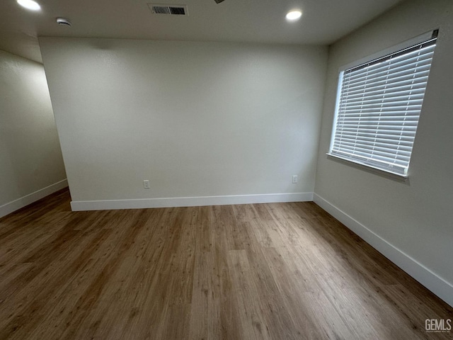 320 10th St, Mc Farland, CA 93250 - unfurnished room with baseboards, recessed lighting, wood finished floors, and visible vents