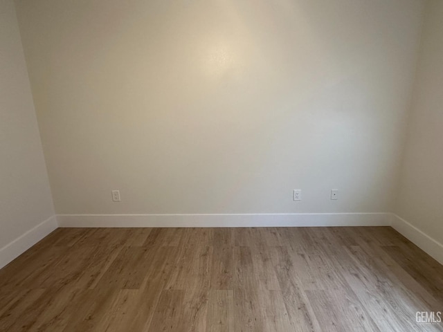 320 10th St, Mc Farland, CA 93250 - empty room featuring baseboards and light wood-style floors