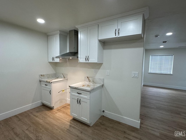 320 10th St, Mc Farland, CA 93250 - kitchen with wall chimney range hood, baseboards, and wood finished floors