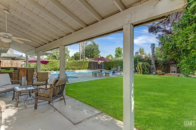 7701 Shetland Dr, Bakersfield, CA 93309 - fenced backyard featuring a patio and ceiling fan