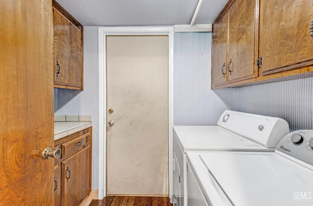 7701 Shetland Dr, Bakersfield, CA 93309 - washroom featuring washer and dryer, cabinet space, and wood finished floors