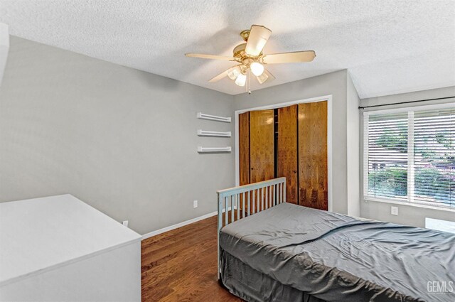 7701 Shetland Dr, Bakersfield, CA 93309 - bedroom featuring a textured ceiling, wood finished floors, ceiling fan, and a closet