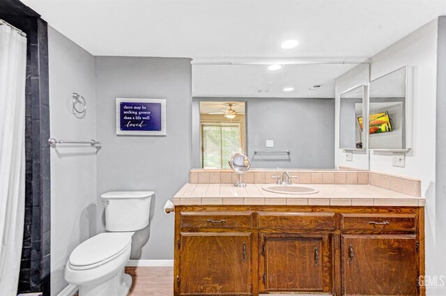 7701 Shetland Dr, Bakersfield, CA 93309 - bathroom with vanity, ceiling fan, wood finished floors, and recessed lighting