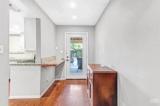 7701 Shetland Dr, Bakersfield, CA 93309 - doorway to outside with wood finished floors and recessed lighting