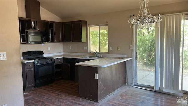 5610 Plute Pass St, Bakersfield, CA 93307 - kitchen with black appliances, a chandelier, light countertops, dark wood-style flooring, and lofted ceiling