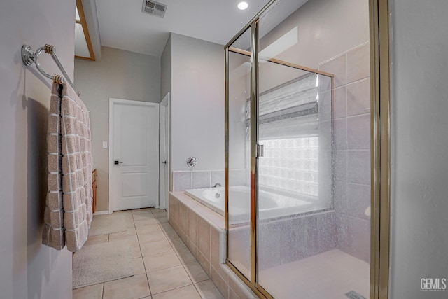 bathroom with visible vents, a garden tub, a stall shower, and tile patterned flooring