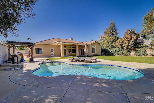 view of pool with a pergola, a patio, a fenced backyard, a yard, and a fenced in pool