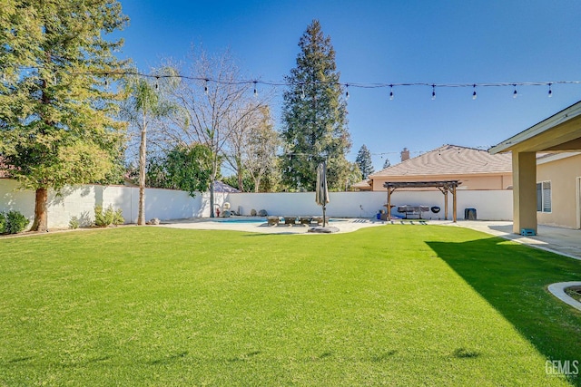 view of yard with a fenced backyard, a pergola, and a patio