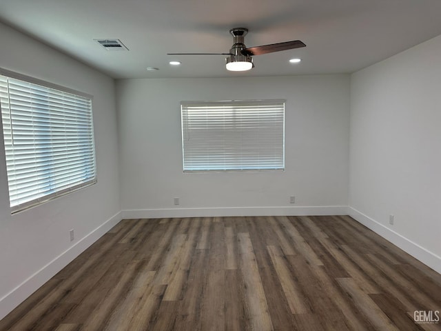 unfurnished room with baseboards, visible vents, ceiling fan, wood finished floors, and recessed lighting