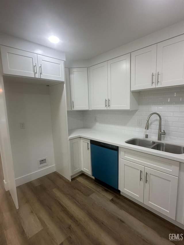 kitchen with a sink, white cabinetry, dark wood finished floors, and dishwasher