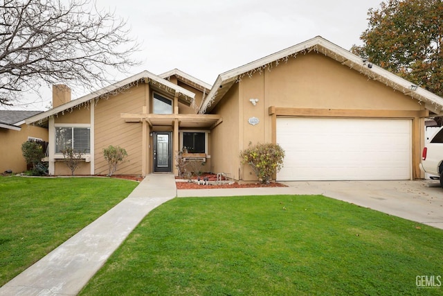 view of front of house with a garage and a front lawn