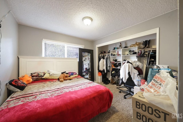 carpeted bedroom featuring a closet and a textured ceiling