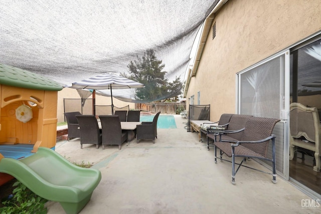 view of patio featuring a fenced in pool