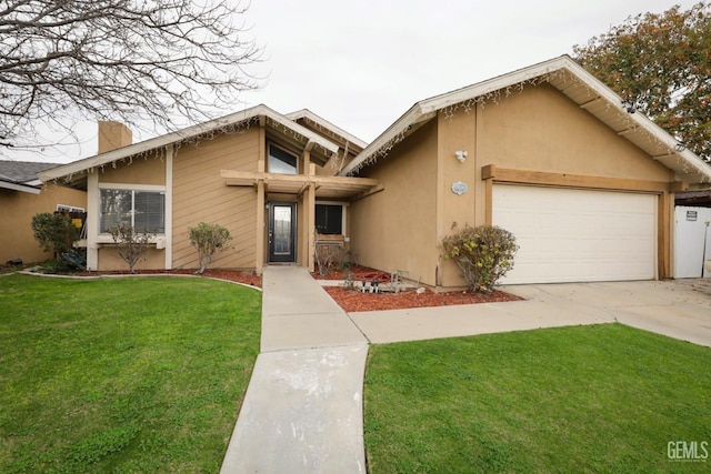 view of front of home with a garage and a front yard