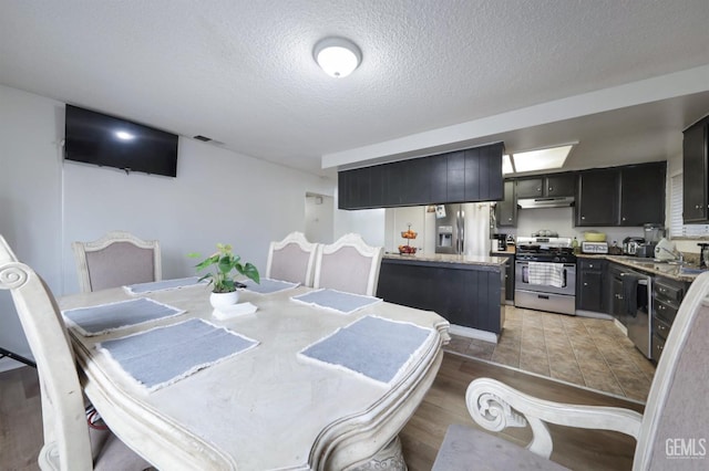 dining space with a textured ceiling