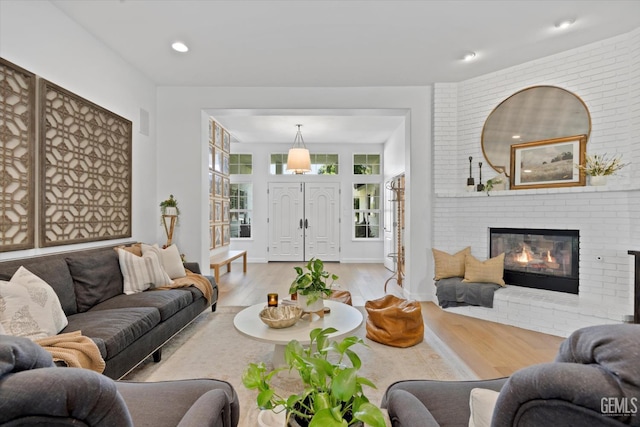 6707 Park W Cir, Bakersfield, CA 93308 - living area with wood finished floors, a fireplace, and recessed lighting