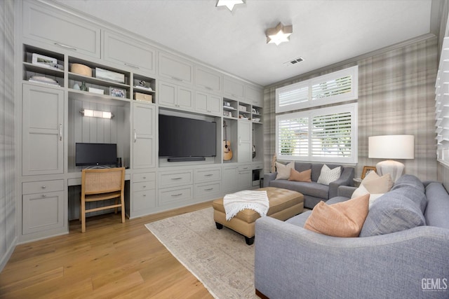 6707 Park W Cir, Bakersfield, CA 93308 - living room with light wood-style floors and built in desk