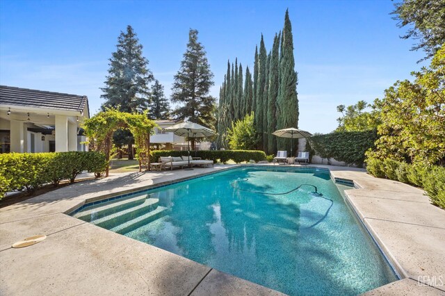 6707 Park W Cir, Bakersfield, CA 93308 - view of pool featuring a patio area and an outdoor hangout area