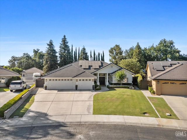 6707 Park W Cir, Bakersfield, CA 93308 - view of front of home featuring driveway, a tiled roof, solar panels, and a garage