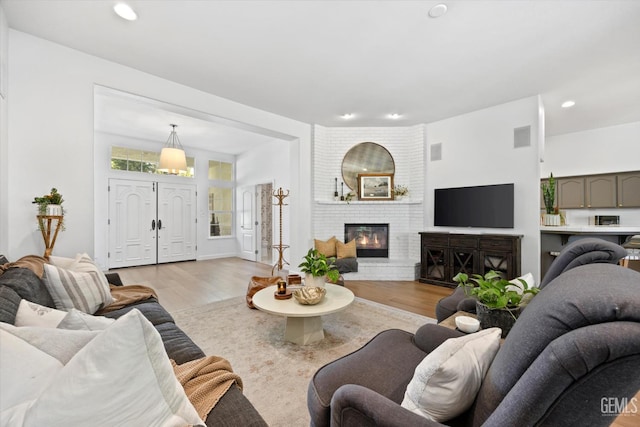 6707 Park W Cir, Bakersfield, CA 93308 - living area with light wood-style floors, a fireplace, and recessed lighting