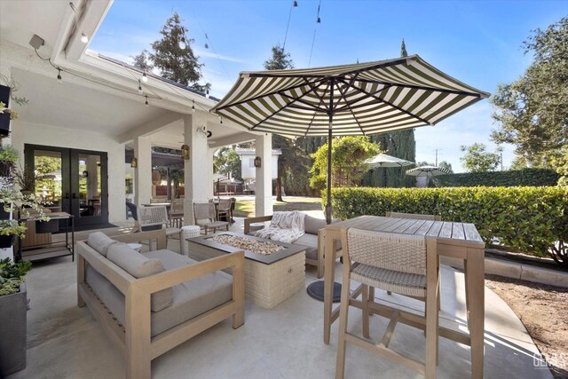 6707 Park W Cir, Bakersfield, CA 93308 - view of patio / terrace featuring a fire pit, french doors, and outdoor dining space