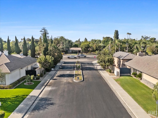 6707 Park W Cir, Bakersfield, CA 93308 - view of asphalt street featuring a gate, a gated entry, and curbs