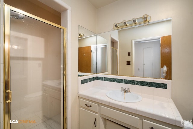 full bathroom with decorative backsplash, vanity, and a shower stall